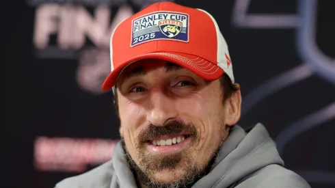 Brad Marchand smiling at a press conference.
