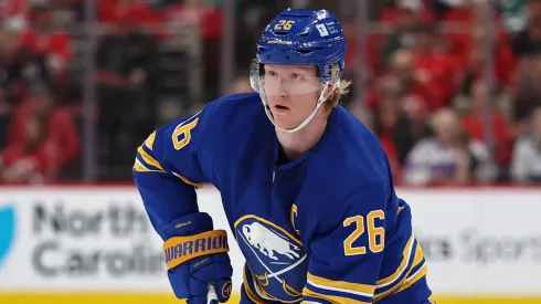 Rasmus Dahlin #26 of the Buffalo Sabres skates with the puck.