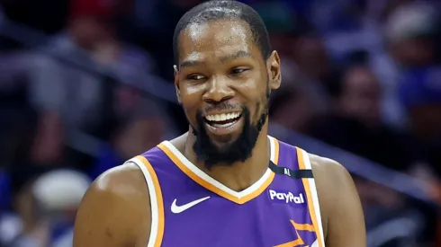 Kevin Durant #35 of the Phoenix Sun looking down in an NBA game.