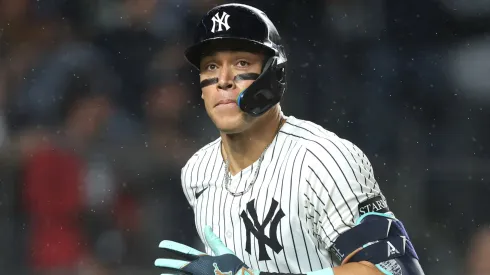 Aaron Judge #99 of the New York Yankees reacts to hitting a solo home run.