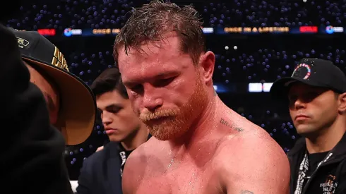 Canelo Alvarez has the tape cut off his glove after his undisputed super middleweight title fight against Terence Crawford.
