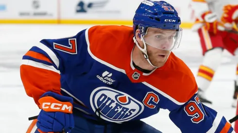 Connor McDavid #97 of the Edmonton Oilers skates past Kevin Bahl #7 of the Calgary Flames.