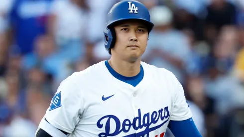 Shohei Ohtani #17 of the Los Angeles Dodgers walks to the dugout.