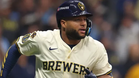 Jackson Chourio #11 of the Milwaukee Brewers rounds the bases after hitting a home run.