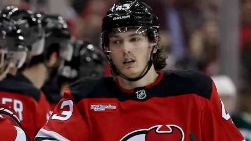 Luke Hughes #43 of the New Jersey Devils celebrates his goal with teammates.