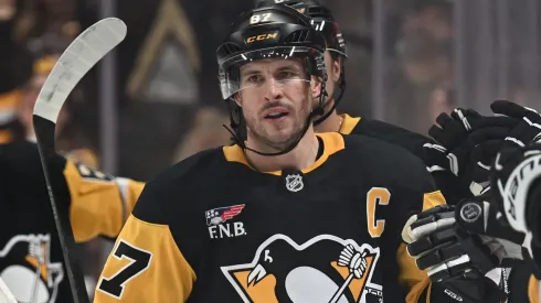 Sidney Crosby #87 of the Pittsburgh Penguins celebrates with teammates on the bench.