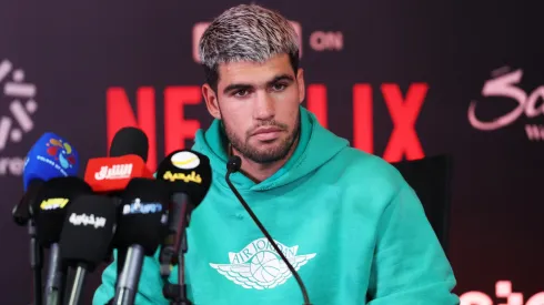 Carlos Alcaraz speaks during a press conference.
