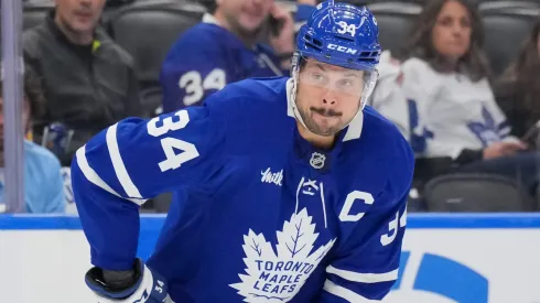 Auston Matthews #34 of the Maple Leafs controls the puck.
