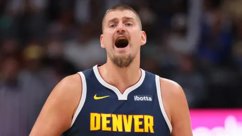 Nikola Jokic #15 of the Denver Nuggets handles the ball.
