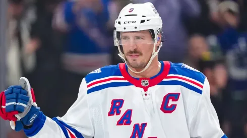 J.T. Miller #8 of the New York Rangers salutes the crowd.