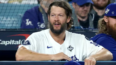 Clayton Kershaw #22 of the Los Angeles Dodgers looks on from the dugout.