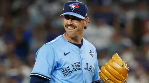 Shane Bieber #57 of the Blue Jays reacts after Teoscar Hernández #37 of the Dodgers hits a single.