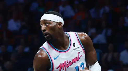 Bam Adebayo #13 of the Miami Heat controls the ball against the Boston Celtics