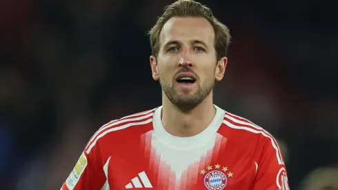 Harry Kane of Bayern Munich carries the match ball.