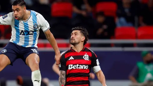 Mohamed Chibi of Pyramids FC heads the ball whilst under pressure from Giorgian de Arrascaeta of CR Flamengo.
