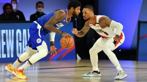 Paul George y Damian Lillard (Getty Images)
