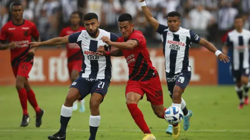 LIMA, PERU - APRIL 04: Josepmir Ballon of Alianza Lima fights for the ball with Tomas Cuello of Athletico Paranaense during a Copa CONMEBOL Libertadores group G match between Alianza Lima and Athletico Paranaense at Estadio Alejandro Villanueva on April 4, 2023 in Lima, Peru. (Photo by Daniel Apuy/Getty Images)