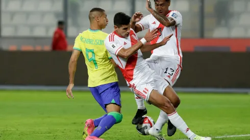 LIMA, PERU – SEPTEMBER 12: Richarlison of Brazil competes for the ball with Renato Tapia of Peru during a FIFA World Cup 2026 Qualifier match between Peru and Brazil at Estadio Nacional de Lima on September 12, 2023 in Lima, Peru. (Photo by Mariana Bazo/Getty Images)