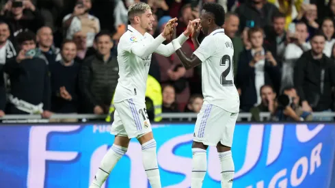 MADRID, SPAIN – OCTOBER 22: Federico Valverde celebrates with Vinicius Junior of Real Madrid after scoring their team's third goal during the LaLiga Santander match between Real Madrid CF and Sevilla FC at Estadio Santiago Bernabeu on October 22, 2022 in Madrid, Spain. (Photo by Angel Martinez/Getty Images)