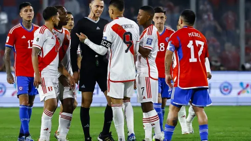 SANTIAGO, CHILE – OCTOBER 12: Referee Wilmar Roldan argues with players during the FIFA World Cup 2026 Qualifier match between Chile and Peru at Estadio Monumental David Arellano on October 12, 2023 in Santiago, Chile. (Photo by Marcelo Hernandez/Getty Images)
