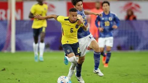 DUESSELDORF, GERMANY – SEPTEMBER 27: Byron Castillo of Ecuador battles for possession with Ao Tanaka of Japan during the international friendly match between Japan and Ecuador at Merkur Spiel-Arena on September 27, 2022 in Duesseldorf, Germany. (Photo by Alex Grimm/Getty Images)
