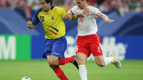 GELSENKIRCHEN, GERMANY - JUNE 09: Arkadiusz Radomski of Poland and Ivan Kaviedes of Ecuador battle for the ball during the FIFA World Cup Germany 2006 Group A match between Poland and Ecuador at the Stadium Gelsenkirchen on June 9, 2006 in Gelsenkirchen, Germany. (Photo by Laurence Griffiths/Getty Images)