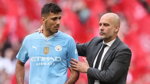 Rodri y Pep Guardiola, jugador y entrenador del Manchester City.
