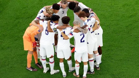 DOHA, QATAR – NOVEMBER 21:  Team United States huddle before the opening kickoff against Wales during the FIFA World Cup Qatar 2022 Group B match between USA and Wales at Ahmad Bin Ali Stadium on November 21, 2022 in Doha, Qatar. (Photo by Elsa/Getty Images)-Not Released (NR) Images cannot be used in books or individually in the form of mobile alert services or downloads without prior approval from FIFA
