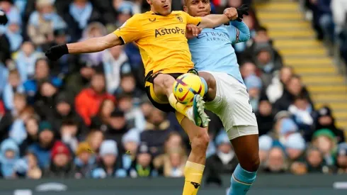 Manchester, England, 22nd January 2023. Raul Jimenez of Wolverhampton Wanderers tussles with Manuel Akanji of Manchester
