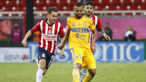 ZAPOPAN, MEXICO – SEPTEMBER 13:  Jesús Angulo of Chivas fights for the ball with Rafael De Souza of Tigres during the 9th round match between Chivas and Tigres UANL as part of the Torneo Apertura 2022 Liga MX at Akron Stadium on September 13, 2022 in Zapopan, Mexico. (Photo by Refugio Ruiz/Getty Images)
