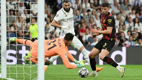 MADRID, SPAIN – MAY 09: Ederson of Manchester City makes a save from Karim Benzema of Real Madrid during the UEFA Champions League semi-final first leg match between Real Madrid and Manchester City FC at Estadio Santiago Bernabeu on May 09, 2023 in Madrid, Spain. (Photo by David Ramos/Getty Images)
