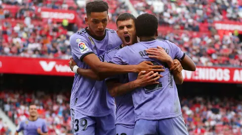 SEVILLE, SPAIN - MAY 27: Rodrygo of Real Madrid celebrates with teammates Alvaro Rodriguez and Dani Ceballos after scoring the team's second goal during the LaLiga Santander match between Sevilla FC and Real Madrid CF at Estadio Ramon Sanchez Pizjuan on May 27, 2023 in Seville, Spain. (Photo by Fran Santiago/Getty Images)