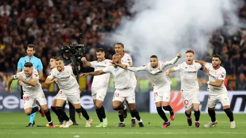 BUDAPEST, HUNGARY – MAY 31: Players of Sevilla FC celebrate after Gonzalo Montiel of Sevilla FC (not pictured) scores the team's fourth penalty in the penalty shoot out during the UEFA Europa League 2022/23 final match between Sevilla FC and AS Roma at Puskas Arena on May 31, 2023 in Budapest, Hungary. (Photo by Maja Hitij/Getty Images)
