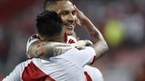 LIMA, PERU - OCTOBER 07: Christian Cueva of Peru celebrates with teammate Paolo Guerrero after scoring the first goal of his team during a match between Peru and Chile as part of South American Qualifiers for Qatar 2022 at Estadio Nacional on October 07, 2021 in Lima, Peru. (Photo by Paolo Aguilar-Pool/Getty Images)