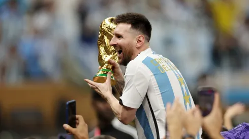 LUSAIL CITY, QATAR – DECEMBER 18: Lionel Messi of Argentina celebrates with the FIFA World Cup Qatar 2022 Winner's Trophy after the team's victory during the FIFA World Cup Qatar 2022 Final match between Argentina and France at Lusail Stadium on December 18, 2022 in Lusail City, Qatar. (Photo by Lars Baron/Getty Images)

