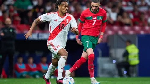 MADRID, SPAIN – MARCH 28: Andre Carrillo of Peru runs with the ball whilst under pressure from Hakim Ziyech of Morocco during the international friendly game between Morocco and Peru at Civitas Metropolitan Stadium on March 28, 2023 in Madrid, Spain. (Photo by Alex Caparros/Getty Images)
