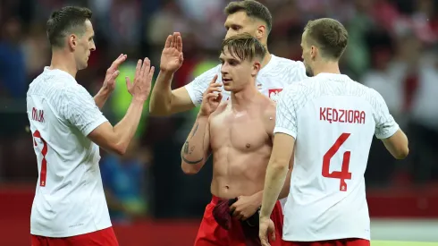 WARSAW, POLAND – JUNE 16: Michal Skoras and team mates of Poland celebrate following their sides victory after the international friendly match between Poland and Germany at Stadion Narodowy on June 16, 2023 in Warsaw, Poland. (Photo by Maja Hitij/Getty Images)
