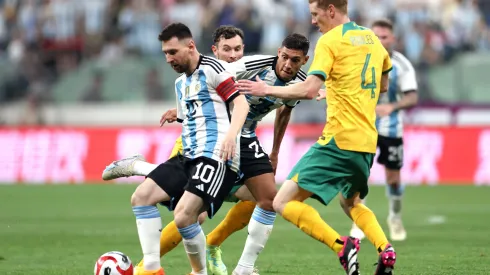 BEIJING, CHINA - JUNE 15: Lionel Messi of Argentina controls the ball against Kye Rowles of Australia during the international friendly match between Argentina and Australia at Workers Stadium on June 15, 2023 in Beijing, China. (Photo by Lintao Zhang/Getty Images)