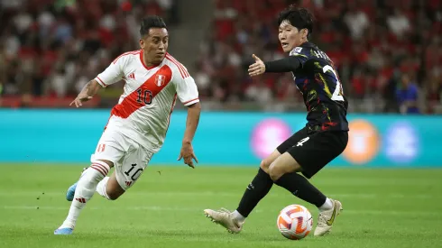 BUSAN, SOUTH KOREA – JUNE 16: Christian Cueva of Peru competes for the ball with Hong Hyun-Seok of South Korea during the international friendly match between South Korea and Peru at Busan Asiad Stadium on June 16, 2023 in Busan, South Korea. (Photo by Chung Sung-Jun/Getty Images)