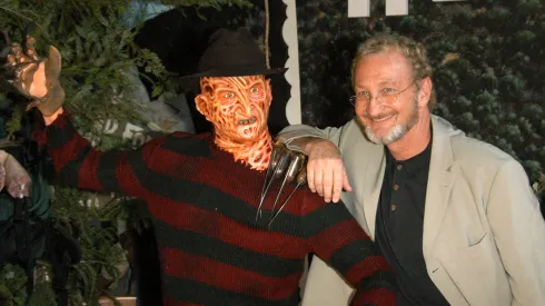 Robert Englund poses with Freddy wax figure at the Hollywood Wax Mueum.
