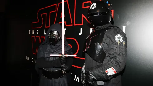 Fans pose at Star Wars: The Last Jedi booth at Armageddon on October 21, 2017.
