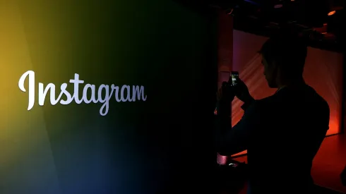 MENLO PARK, CA – JUNE 20:  An attendee takes a photo of the instagram logo during a press event at Facebook headquarters on June 20, 2013 in Menlo Park, California. Facebook announced that its photo-sharing subsidiary Instagram will now allow users to take and share video.  (Photo by Justin Sullivan/Getty Images)
