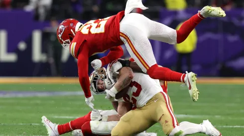 LAS VEGAS, NEVADA – FEBRUARY 11: Christian McCaffrey #23 of the San Francisco 49ers is hit by Justin Reid #20 and Chamarri Conner #27 of the Kansas City Chiefs during the second quarter during Super Bowl LVIII at Allegiant Stadium on February 11, 2024 in Las Vegas, Nevada. (Photo by Jamie Squire/Getty Images)
