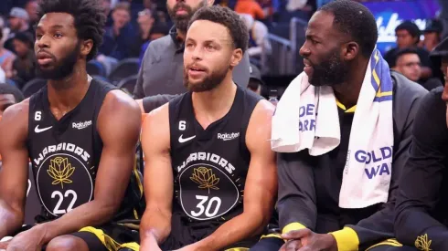 Andrew Wiggins, Stephen Curry y Draymond Green.
