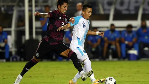 DALLAS, TEXAS – JULY 14: Carlos Salcedo #3 of Mexico and Robin Betancourth #18 of Guatemala fight for the ball in the first half  at Cotton Bowl on July 14, 2021 in Dallas, Texas. (Photo by Richard Rodriguez/Getty Images)
