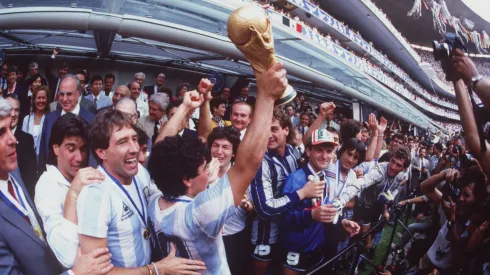 JUL 1986:  DIEGO MARADONA OF ARGENTINA LIFTS THE WORLD CUP TROPHY IN FRONT OF THE WORLD's MEDIA AFTER ARGENTINA BEAT GERMANY 3-2 TO WIN  THE 1986 SOCCER WORLD CUP FINAL. Mandatory Credit: Mike King/ALLSPORT
