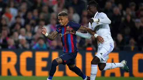 BARCELONA, SPAIN – APRIL 05: Raphinha of FC Barcelona is challenged by Eduardo Camavinga of Real Madrid during the Copa Del Rey Semi Final Second Leg match between FC Barcelona and Real Madrid CF at Spotify Camp Nou on April 05, 2023 in Barcelona, Spain. (Photo by Alex Caparros/Getty Images)

