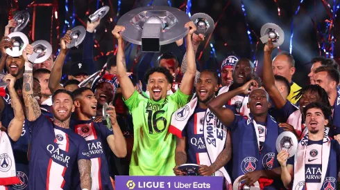 PARIS, FRANCE – JUNE 03: Marquinhos of Paris Saint-Germain, wearing a match shirt featuring the name of Sergio Rico and number 16, lifts the Ligue 1 Uber Eats trophy after the Ligue 1 match between Paris Saint-Germain and Clermont Foot at Parc des Princes on June 03, 2023 in Paris, France. (Photo by Julian Finney/Getty Images)
