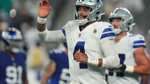 EAST RUTHERFORD, NEW JERSEY – SEPTEMBER 10: Dak Prescott #4 of the Dallas Cowboys reacts after a touchdown run by KaVontae Turpin #9 during the fourth quarter against the New York Giants at MetLife Stadium on September 10, 2023 in East Rutherford, New Jersey. (Photo by Mitchell Leff/Getty Images)
