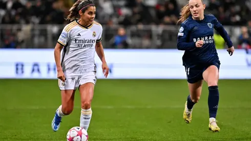 PARIS, FRANCE – DECEMBER 14: Kenti Robles of Real Madrid runs with the ball whilst under pressure from Julie Dufour of Paris FC during the UEFA Women's Champions League group stage match between Paris FC and Real Madrid CF at Stade Charlety on December 14, 2023 in Paris, France. (Photo by Aurelien Meunier – UEFA/UEFA via Getty Images)
